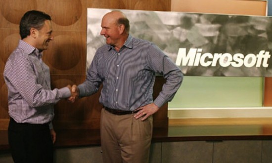 Yammer CEO David Sacks (left) and Microsoft CEO Steve Ballmer shake hands