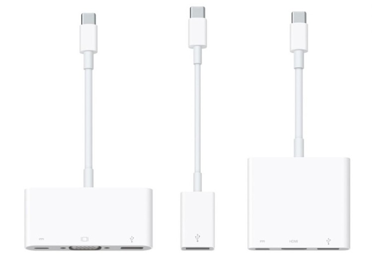 The various adapters that you can use to get your devices to work with the new Macbook. The $20 single USB adapter pictured centre and the multiple USB port adapters with HDMI or VGA output left and right.